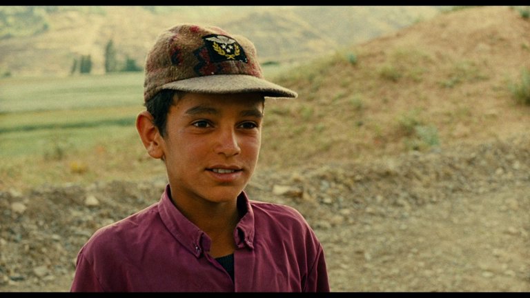 Screen capture from The Wind Will Carry Us