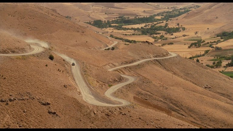 Screen capture from The Wind Will Carry Us