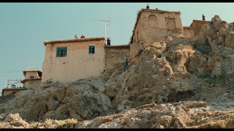 Screen capture from The Wind Will Carry Us