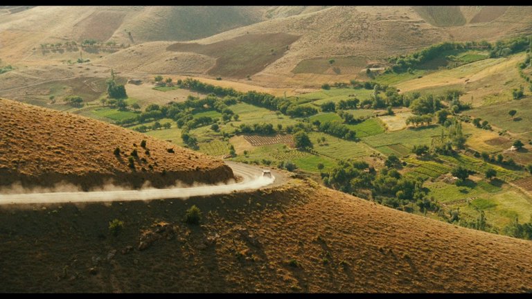 Screen capture from The Wind Will Carry Us