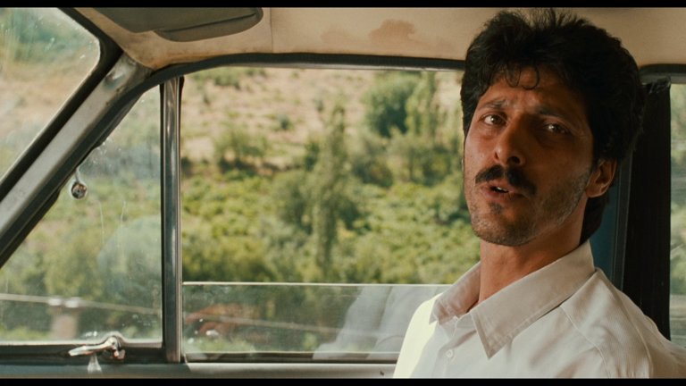 Screen capture from The Wind Will Carry Us