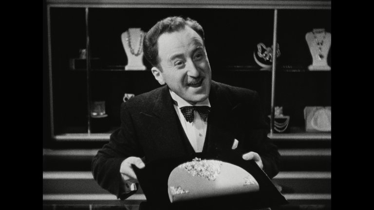 Screen capture from Trouble in Paradise
